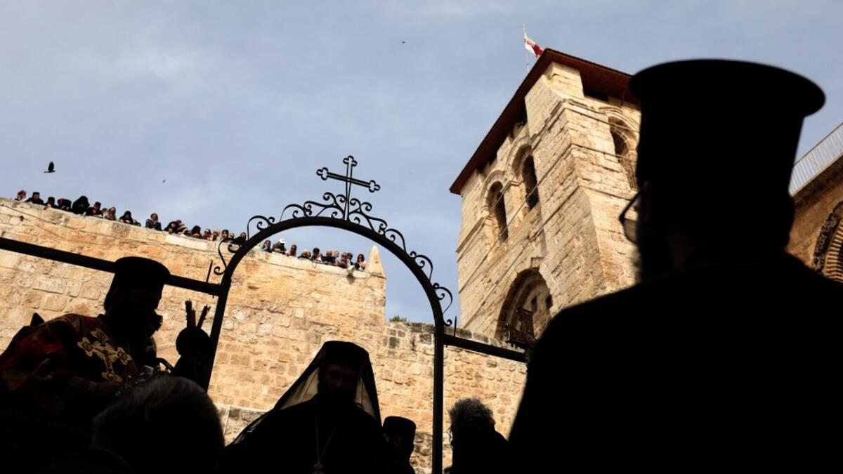 Greek Orthodox priests participate in the traditional Washing of the Feet ceremony in front of the church of the Holy Sepulchre, in Jerusalem's Old City, on April 25, 2019 as part of the Orthodox Holy Week celebrations.  GALI TIBBON / AFP