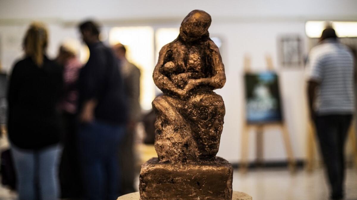 Sunlight floods into a brand new library at the cultural centre where books line shelves along a wall that still smells of wet paint. DELIL SOULEIMAN / AFP