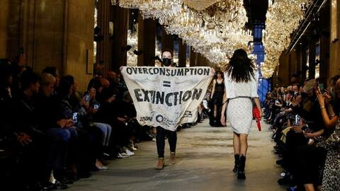 Climate Activist Takes Over Catwalk During Paris Fashion Week