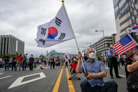 Seoul May Offer Aid to North Korea if It Commits to....