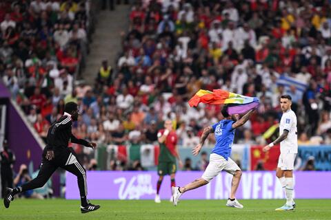 Man breaks into World Cup match holding LGBTQ+ flag
