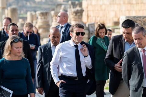 Macron photo printed on cigarette pack warning label