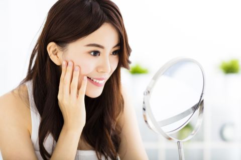 Why are Japanese training on how to smile?