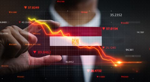 Egypt devalues its pound with record interest rate hike
