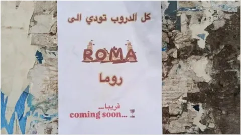 'All ways lead to Rome': Street posters cause controversy in Syria