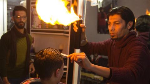 Blazing a trail in Gaza: Haircuts with fire