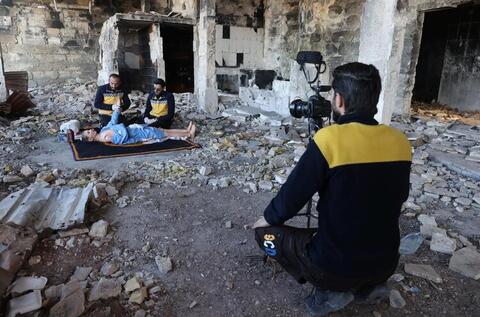 In Pictures: Volunteers and a 'Musaharati' Deliver Pre-Dawn Meals in Syria